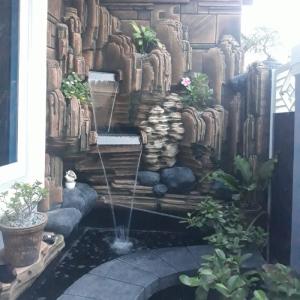 jasa bikin kolam ikan koi tebing